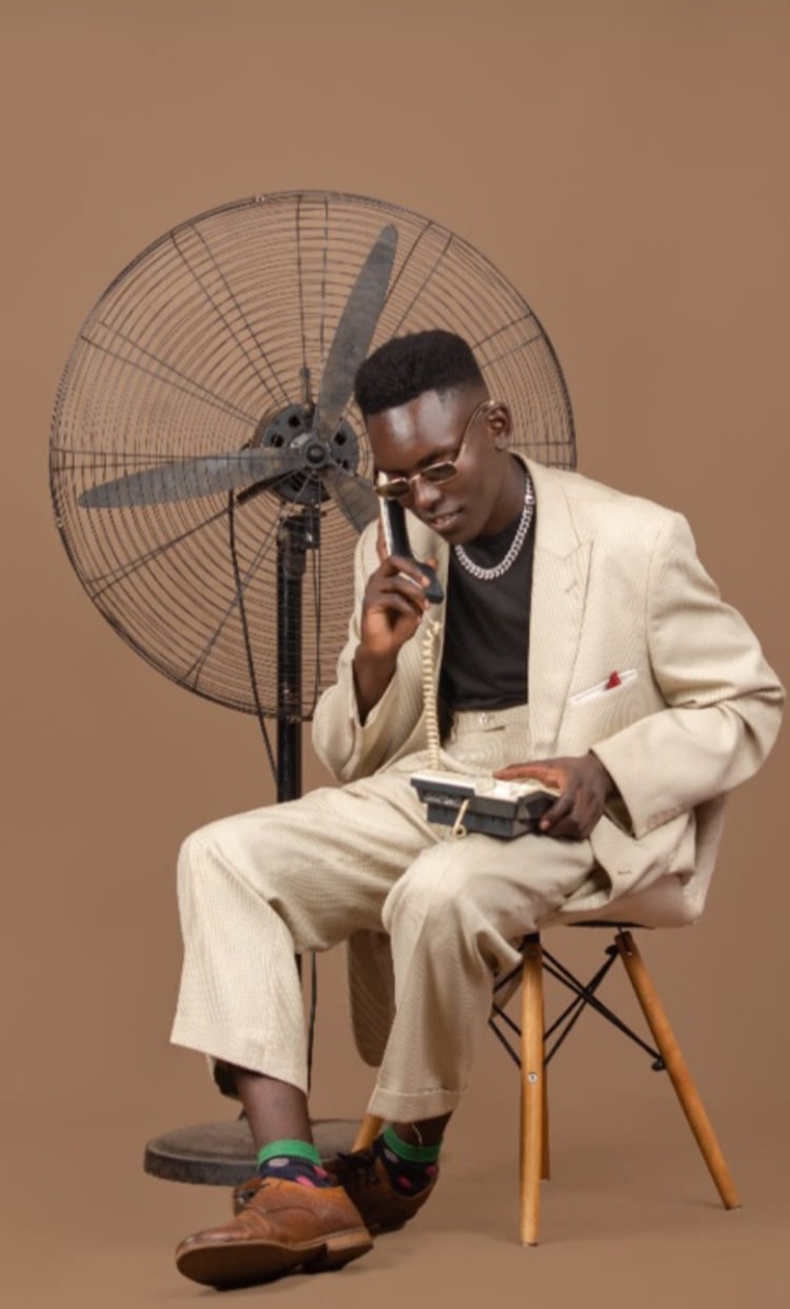 Tailored cream suit styled in studio